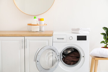 Modern washing machine in kitchen