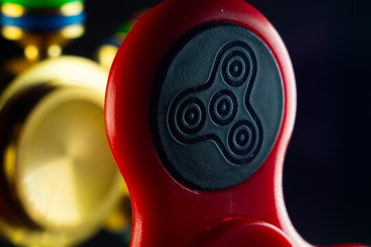 Closeup shot of details on a red fidget spinner