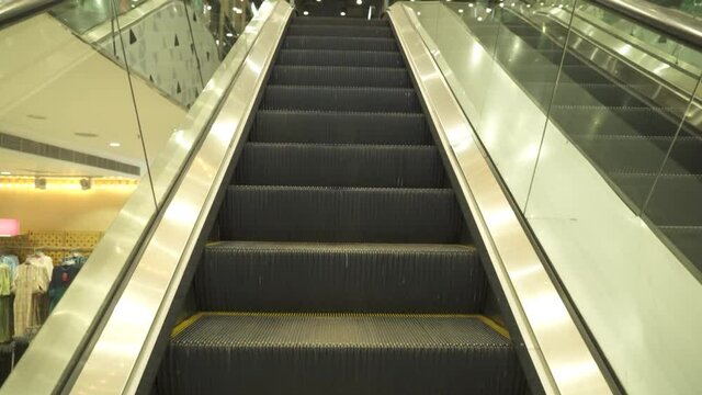 Moving up the escalator into fashion store	