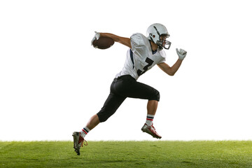 Portrait of American football player training isolated on white studio background with green grass....