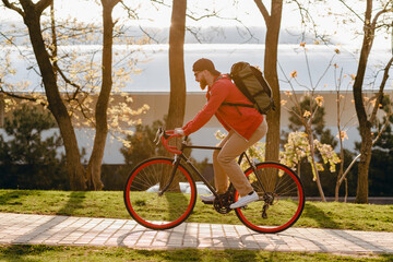 handsome bearded man traveling with bicycle in morning