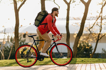 handsome bearded man traveling with bicycle in morning