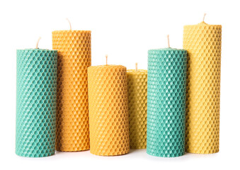 Handmade wax candles on white background