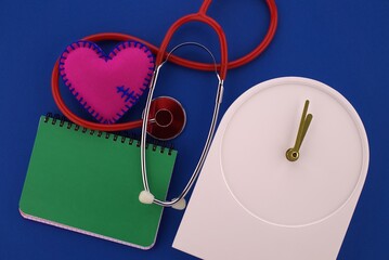 Medical concept with stethoscope and red heart