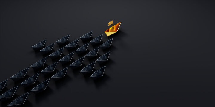 Arrow shaped group of black paper boats on a dark background with a single golden leader boat ahead