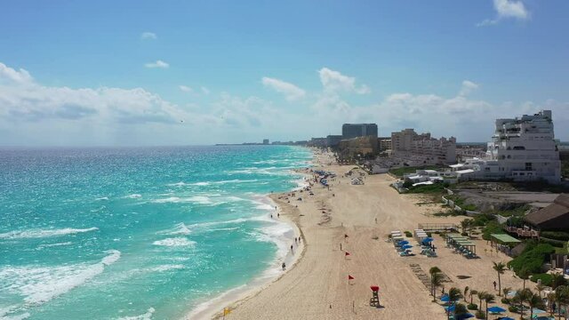 Flying over Cancun's sandy beach and turquoise water