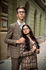 Young couple in eyeglasses, formal clothes 