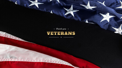 Happy Veterans Day concept. American flag and inscription with congratulations against a black background.