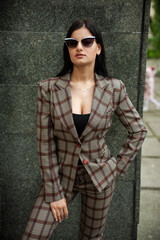 Stylish woman in sunglasses in the city