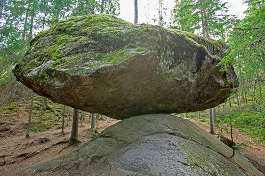 A large balancing boulder rock called Kummakivi in Finnish nature near Ruokolahti