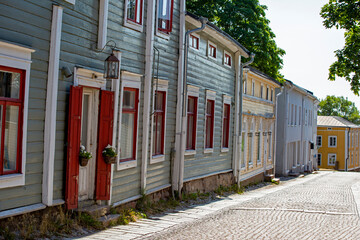 View of an empty street lined with colorful wooden houses in old town of Porvoo, Finland, Europe