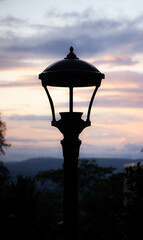 Lamp post light at sunset in the city