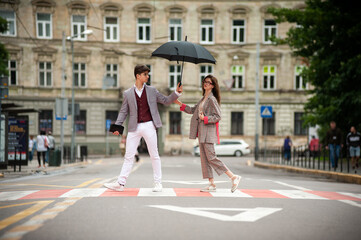 Fototapeta premium Stylish couple in the city. Young students
