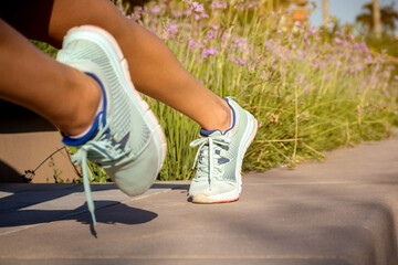 Runner in starting position. Shoe detail plan. Lifestyle and sport concept.