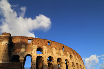 Blue sky with puffy clouds over the Colosseo 