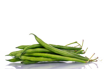 Several ripe green beans, close-up, isolated on white.