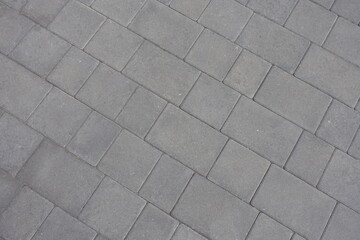 Rough surface of gray concrete pavement (diagonal view)