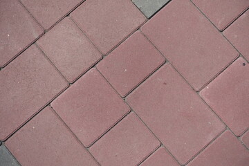Backdrop - pavement made of simple pink concrete bloacks (diagonal view)