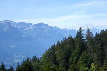 Fototapeta premium Panoramic view from mountain Brienzer Rothorn at Bernese Highland on a beautiful sunny summer day. Photo taken July 21st, 2021, Flühli, Switzerland.