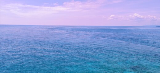 Fototapeta premium blue sky and sea beautiful ocean purple sea twilight sky sky and ocean nature cloud beach natural beauty water ocean diving wallpaper background