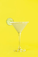 Glass with tasty daiquiri cocktail on color background