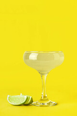 Glass with tasty daiquiri cocktail on color background
