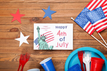 Fototapeta premium Greeting card for Independence Day with tableware and American flags on wooden background