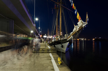 Fototapeta na wymiar SAILING SHIP - An elegant schooner moored at the quay of the sea 