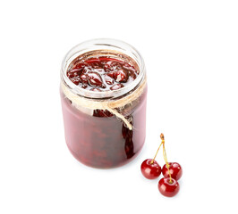 Glass jar with tasty cherry jam on white background