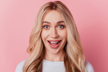 Portrait of funny surprised girl open mouth omg reacting on pink background
