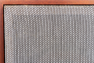 Close up of vintage speaker with fabric grill