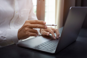 closeup hands of businessman working at office, Man typing keyboard on laptop or computer