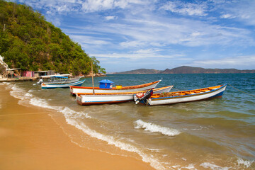 Fototapeta na wymiar Fishing boats on Playa Cochaima, Santa Fe - Venezuela