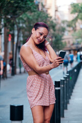 Fototapeta premium Portrait of a latina woman in the city - fashion concept