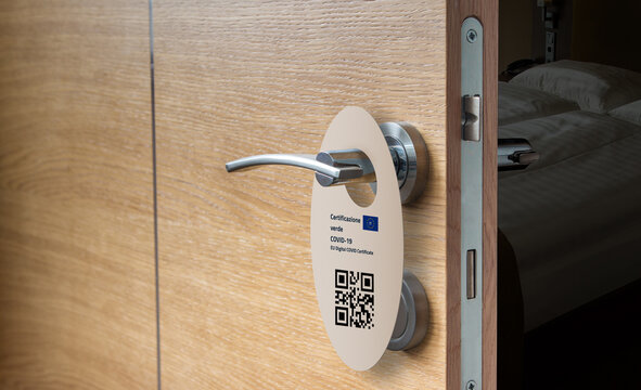 hotel room door with request for a green pass for access