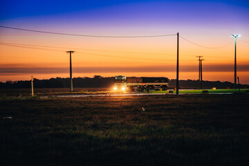 Fototapeta na wymiar Truck going fast in a lonely road.