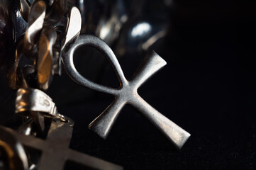 Closeup shot of a silver Ankh amulet charm