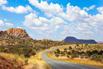 The clouds float in the blue sky