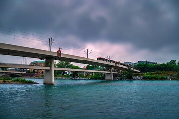 City Train Crossing The Bridge On A Cloudy Day