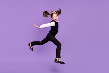 Fototapeta na wymiar Photo of funky hurry fast runner schoolgirl jump run rush wear uniform shoes isolated violet color background