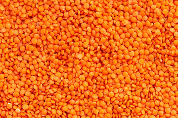 Organic raw red lentils background texture