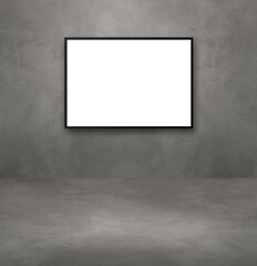 Black picture frame hanging on a dark concrete wall