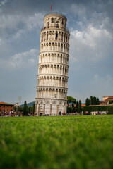 Leaning tower of Pisa from a low perspective with clouds