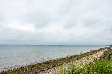 Fototapeta na wymiar beautiful deserted rustic beach on the english coast in West Sussex England