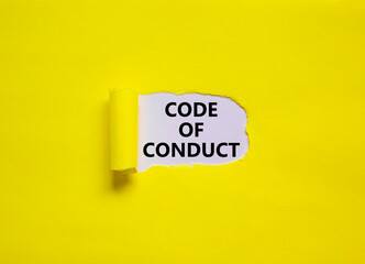 Code of conduct symbol. Words 'Code of conduct' appearing behind torn yellow paper. Beautiful yellow background. Business, code of conduct concept, copy space.