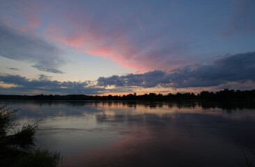 Cloudy sunset over Wisła river in Kazimierz Dolny in Poland.