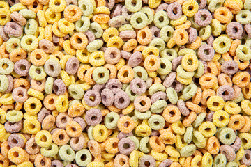 Multi color breakfast round cereal food background.