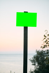 Empty road sign with elements of sky and nature.