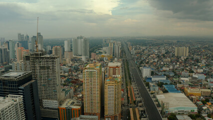 Naklejka premium Cityscape of Makati, the business center of Manila. Asian metropolis with skyscrapers view from above. Travel vacation concept.