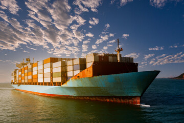 container cargo ship carrying commercial container in import export business commerce logistic and...